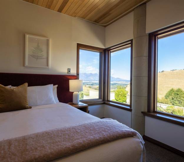 Bedroom view in the Deluxe Takatimu Suite | Cabot Lodge | Luxury Hotel Fiordland | Luxury Hotel Te Anau